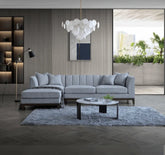 Luxury Cooper dolphin grey bouclé corner sofa with spacious L-shaped seating, premium textured upholstery, solid wooden plinth base, and modern mid-century styling for UK homes.