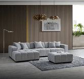 Leonard modular corner sofa upholstered in cloudy grey bouclé fabric featuring block-stitched cushions, spacious L-shaped seating, and contemporary styling for modern UK homes.