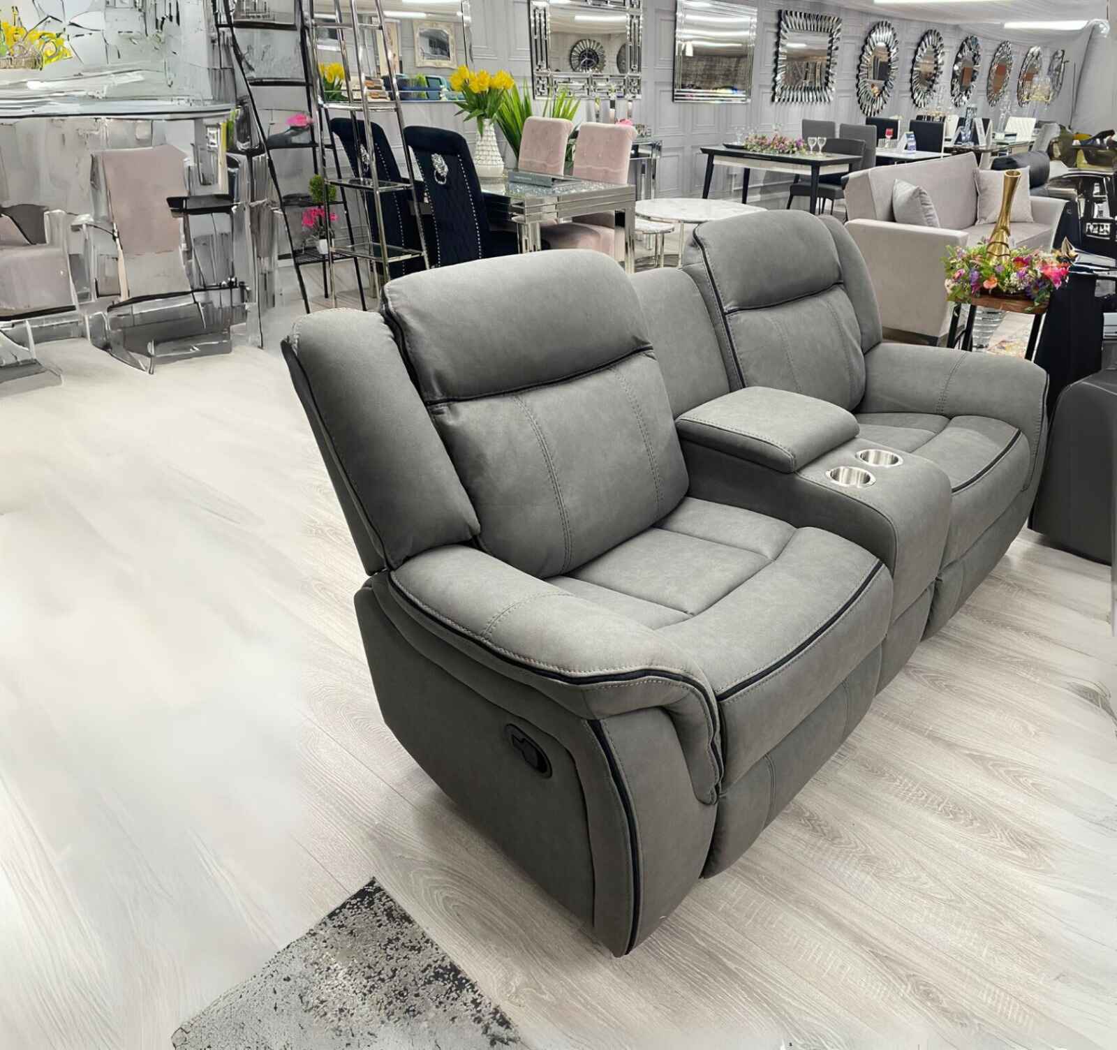 Stylish grey suede leather reclining sofa set with comfortable family seating.