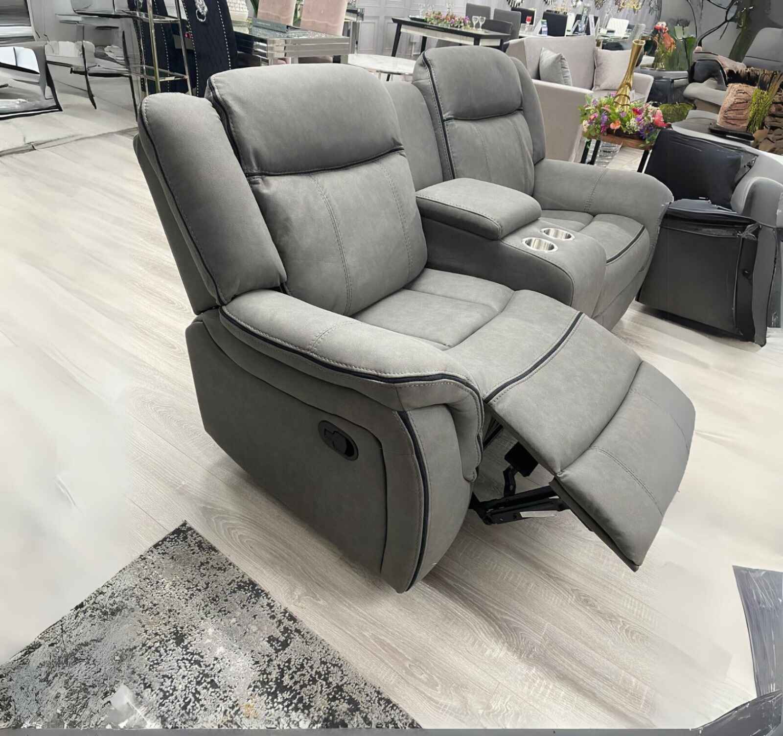 Premium grey recliner sofa set combining suede leather upholstery with modern design.