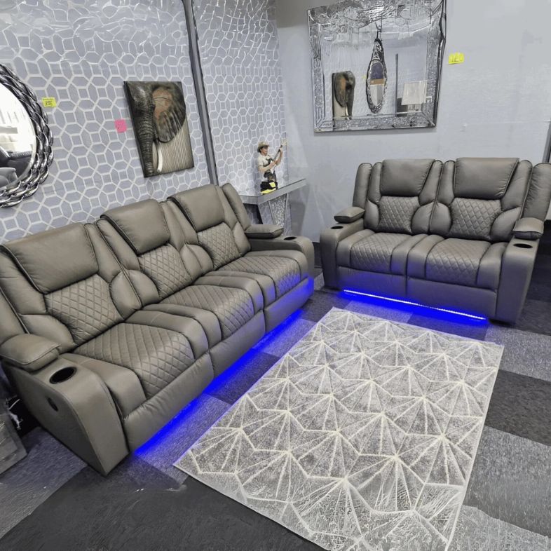 Stylish black electric recliner sofa with LED lighting, USB ports and integrated storage.