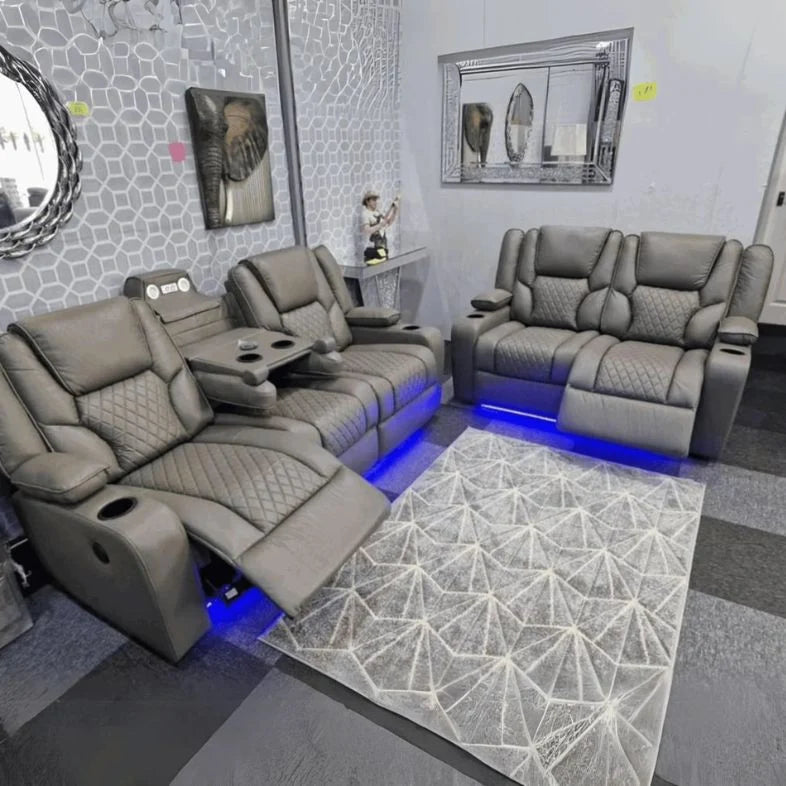 Premium grey power recliner sofa with fold-down table, reading lights and cup holders.