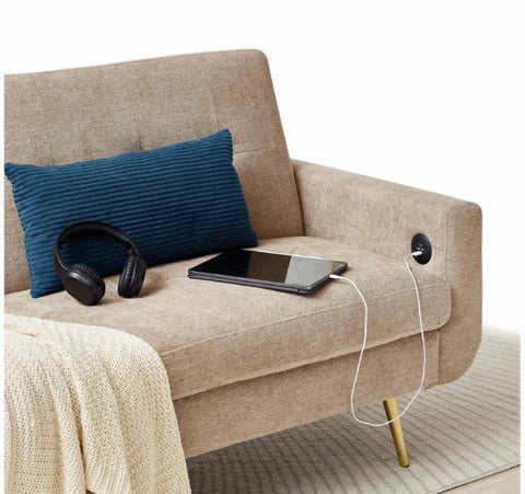Luxury Lexi 3-seater fabric sofa bed with built-in USB charging ports, adjustable backrest, gold metal legs, and contemporary styling in a modern UK living room.