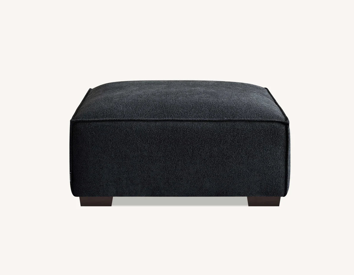 Luxury charcoal bouclé 4 seater sofa with chaise for modern UK living rooms.