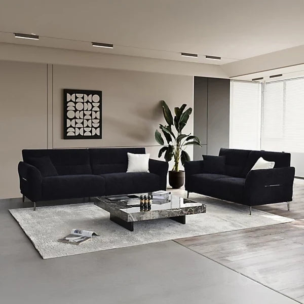 Luxury black bouclé sofa with deep channel stitching, premium textured upholstery, and a modern contemporary design available in 2, 3, and 4 seater sizes.