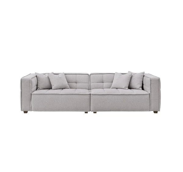 Murray sofa upholstered in premium putty bouclé fabric featuring Chesterfield-inspired button detailing, bold box arms, and contemporary styling for modern UK living rooms.