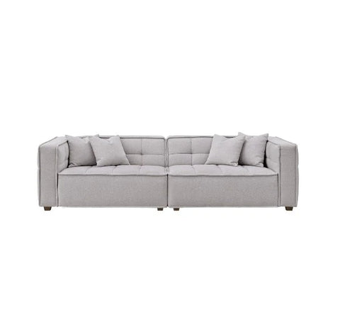 Murray sofa upholstered in premium putty bouclé fabric featuring Chesterfield-inspired button detailing, bold box arms, and contemporary styling for modern UK living rooms.