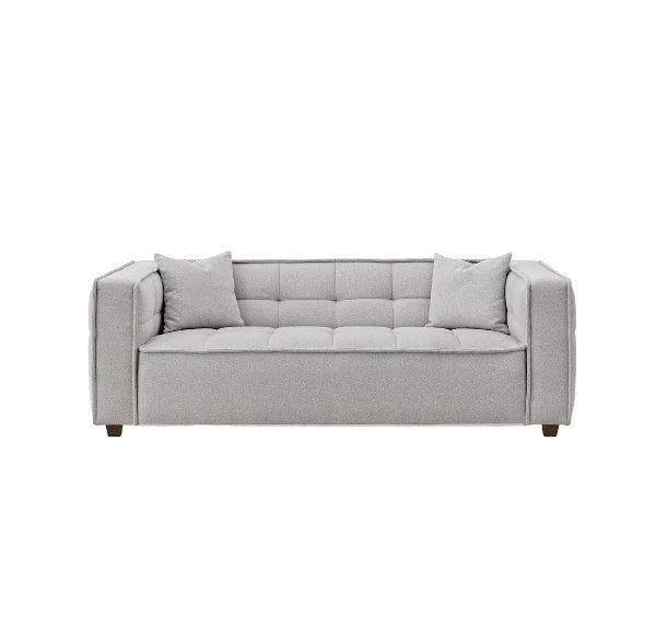 Luxury Murray sofa upholstered in premium putty bouclé fabric featuring Chesterfield-inspired button detailing, bold box arms, and contemporary styling for modern UK living rooms.