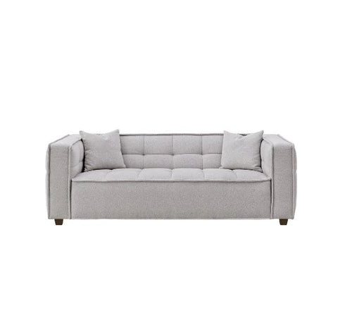 Luxury Murray sofa upholstered in premium putty bouclé fabric featuring Chesterfield-inspired button detailing, bold box arms, and contemporary styling for modern UK living rooms.