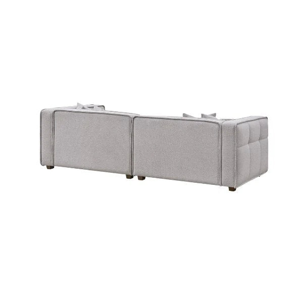 Luxury Murray sofa upholstered in premium putty bouclé fabric featuring Chesterfield-inspired button detailing.