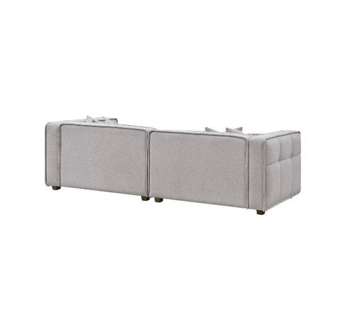 Luxury Murray sofa upholstered in premium putty bouclé fabric featuring Chesterfield-inspired button detailing.