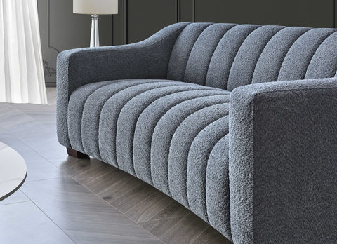 bouclé sofa in iron grey with deep channel stitching, premium textured fabric, and a contemporary Chesterfield-inspired design for modern living rooms.