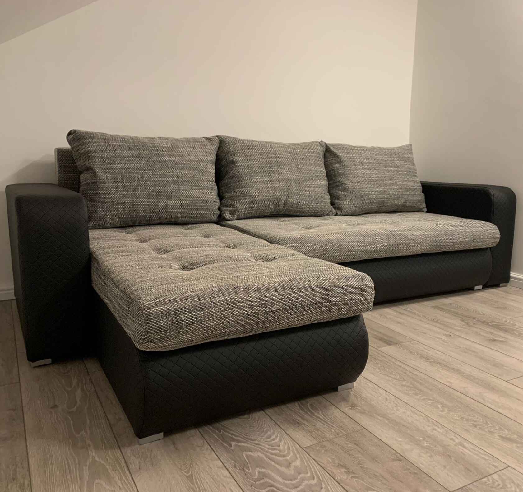 Luxury Berlin fabric corner sofa bed with hidden storage compartments, pull-out sleeping function, universal left or right-hand configuration, and contemporary styling for modern UK homes.
