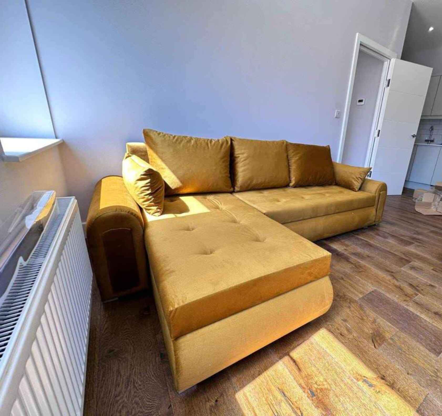Luxury Berlin fabric corner sofa bed with hidden storage compartments, pull-out sleeping function, universal left or right-hand configuration, and contemporary styling for modern UK homes.