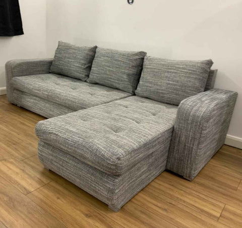 Luxury Berlin fabric corner sofa bed with hidden storage compartments, pull-out sleeping function, universal left or right-hand configuration, and contemporary styling for modern UK homes.