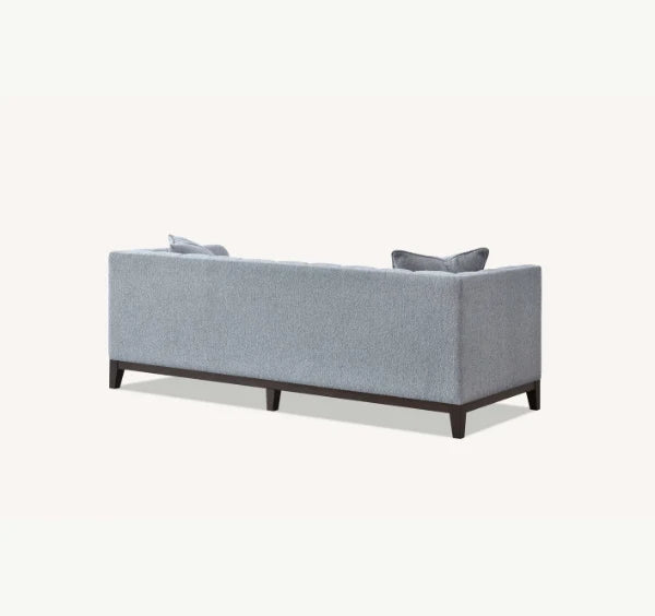 Luxury Cooper 3 Seater Sofa upholstered in dolphin grey bouclé fabric with deep cushions, wooden plinth base for stylish UK homes.
