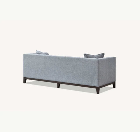Luxury Cooper 3 Seater Sofa upholstered in dolphin grey bouclé fabric with deep cushions, wooden plinth base for stylish UK homes.