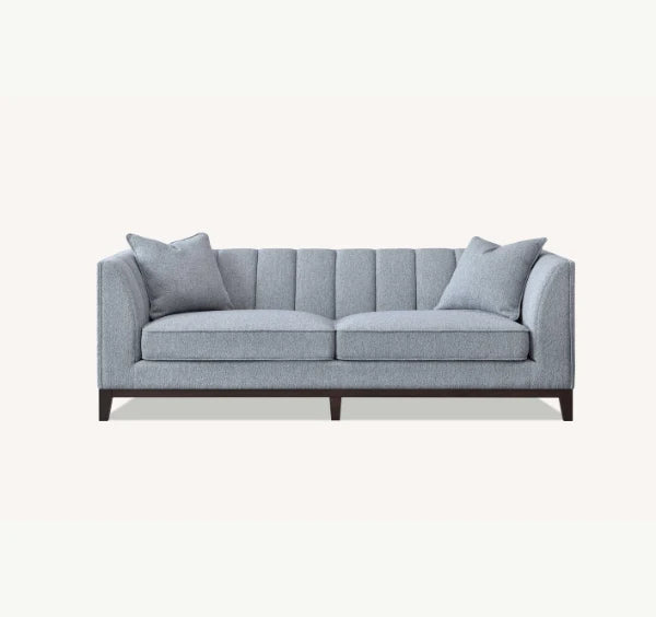  3 Seater Luxury Cooper Sofa upholstered in dolphin grey bouclé fabric with deep cushions, wooden plinth base, and a modern mid-century silhouette for stylish UK homes.