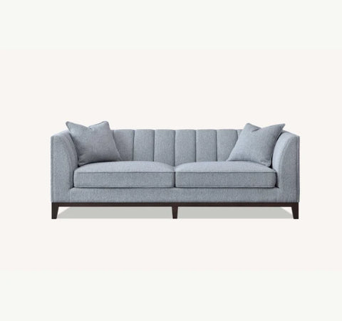  3 Seater Luxury Cooper Sofa upholstered in dolphin grey bouclé fabric with deep cushions, wooden plinth base, and a modern mid-century silhouette for stylish UK homes.