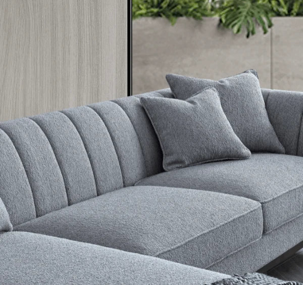 Luxury Cooper dolphin grey bouclé corner sofa with spacious L-shaped seating, solid wooden plinth base, and modern mid-century styling for UK homes.