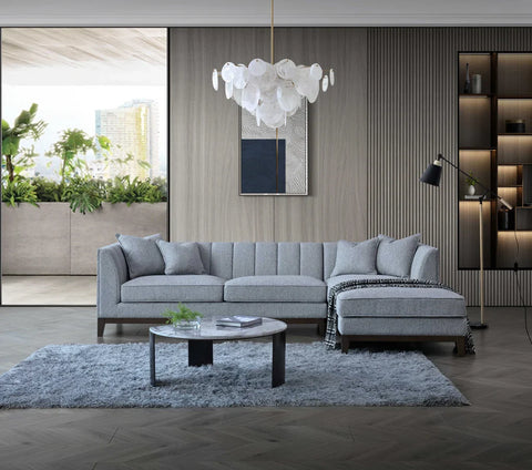Cooper dolphin grey bouclé corner sofa with spacious L-shaped seating, premium textured upholstery, solid wooden plinth base, and modern mid-century styling for UK homes.