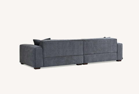 Modern charcoal bouclé chaise sofa with elegant piping and walnut feet.