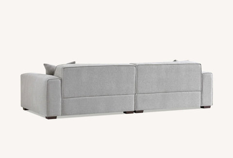 Spacious four seater charcoal sofa with chaise and contemporary minimalist design.