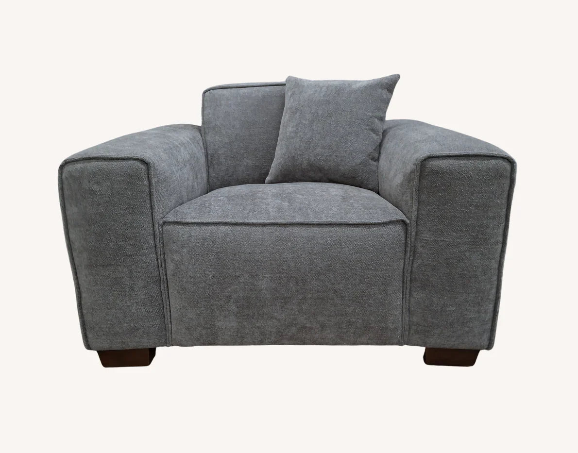 Designer charcoal bouclé sofa with chaise lounge and premium comfort seating.