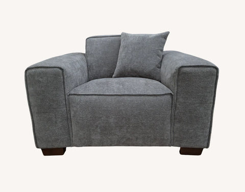Designer charcoal bouclé sofa with chaise lounge and premium comfort seating.