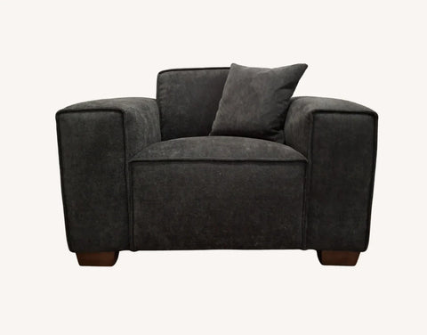 Elegant modern living room sofa in charcoal bouclé with feather-filled cushions.