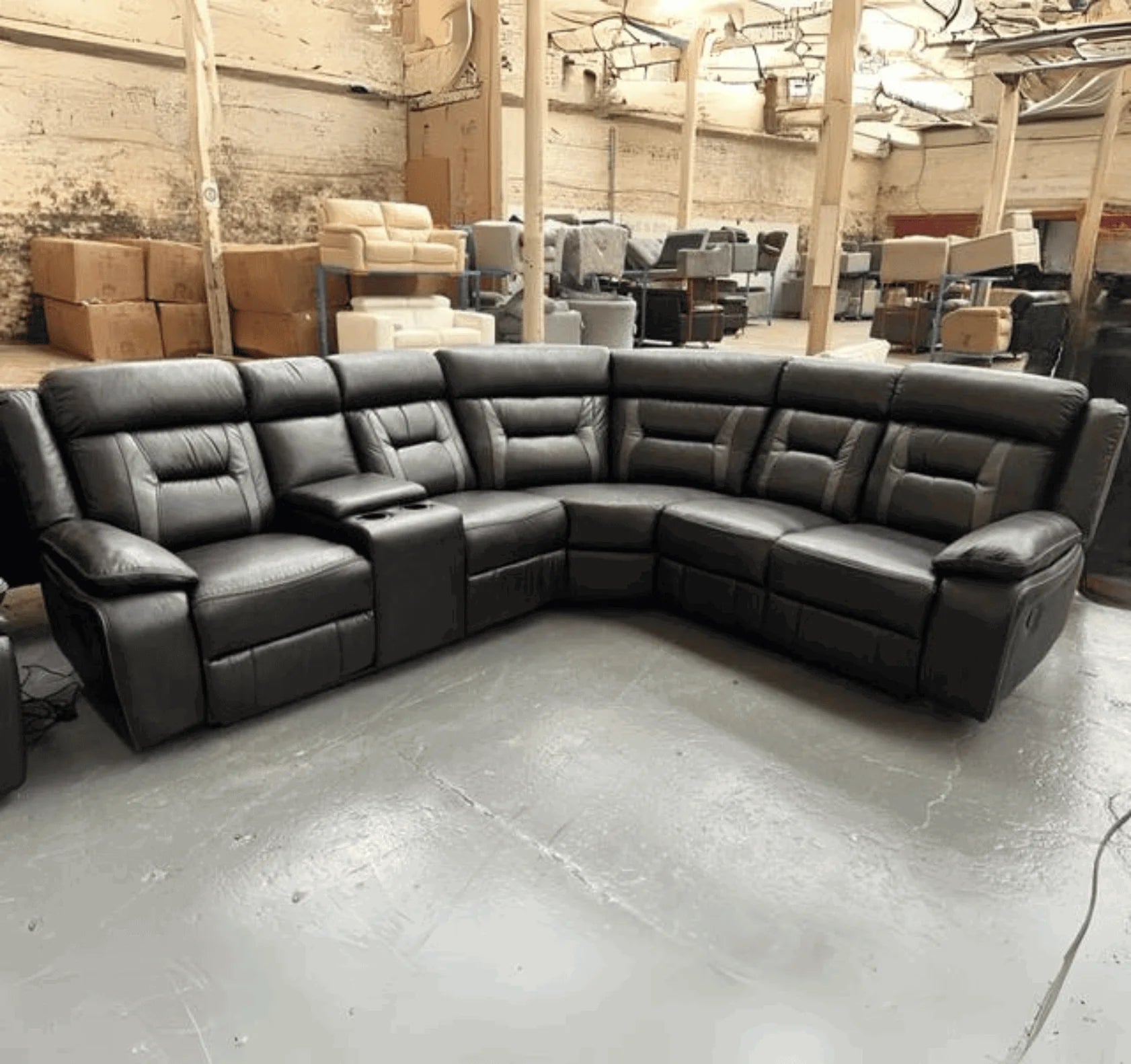 Nova black electric leather corner recliner sofa with grey trim and spacious 5 seater design.