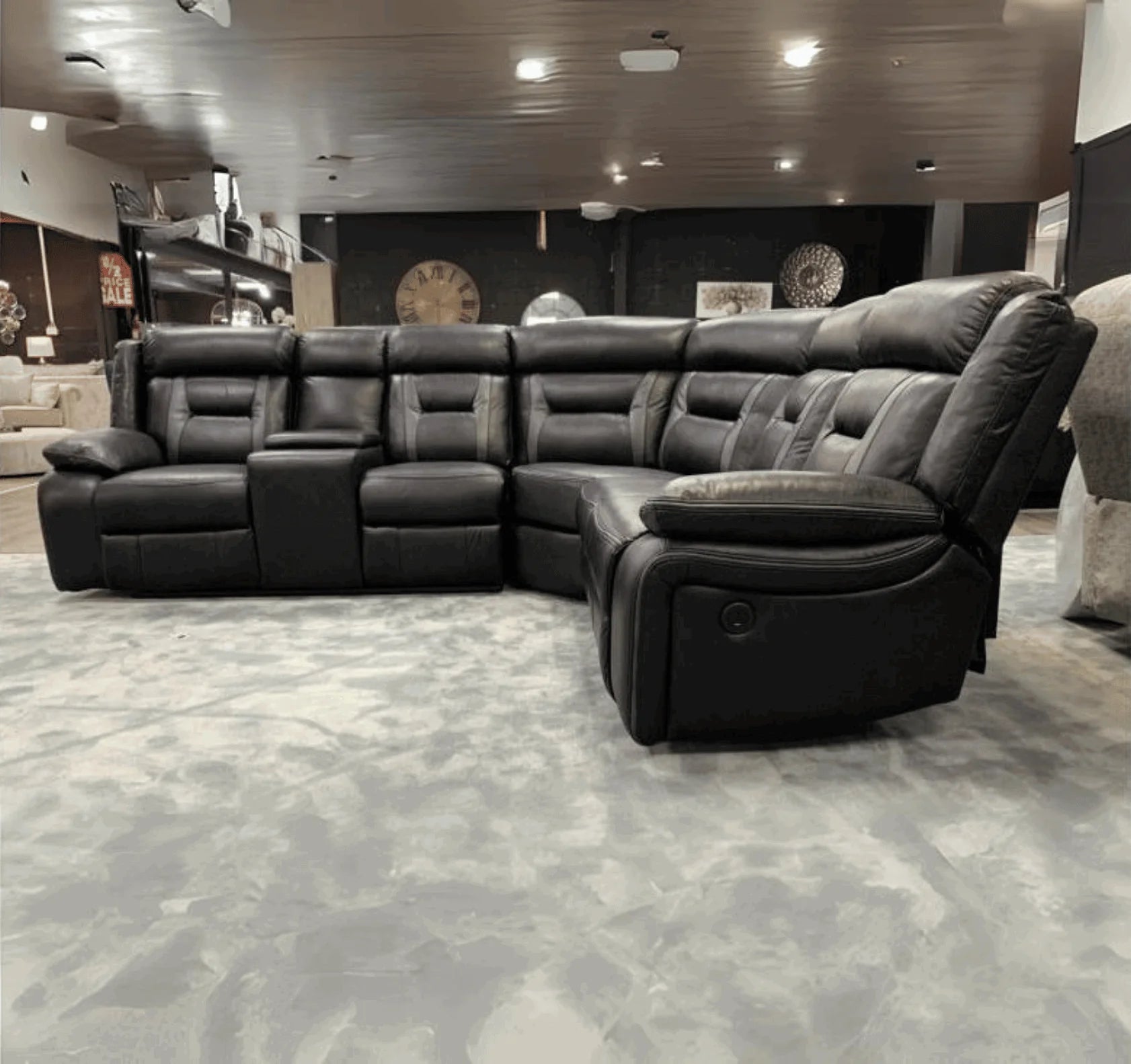Nova black leather-look power recliner corner sofa with electric reclining seats.