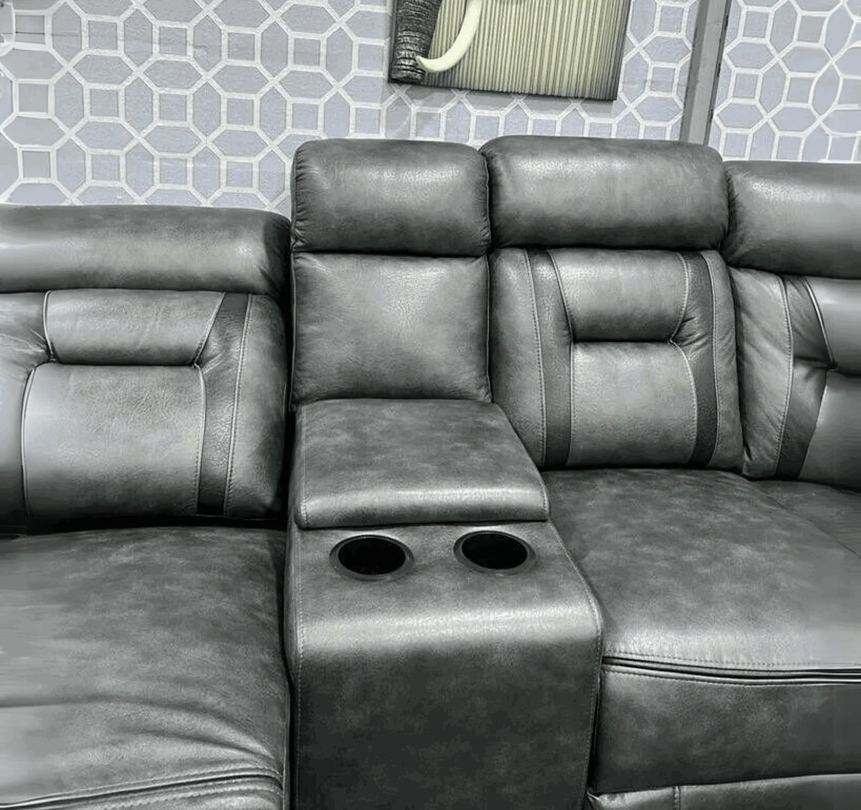 Modern electric corner sofa with USB ports and integrated storage console.