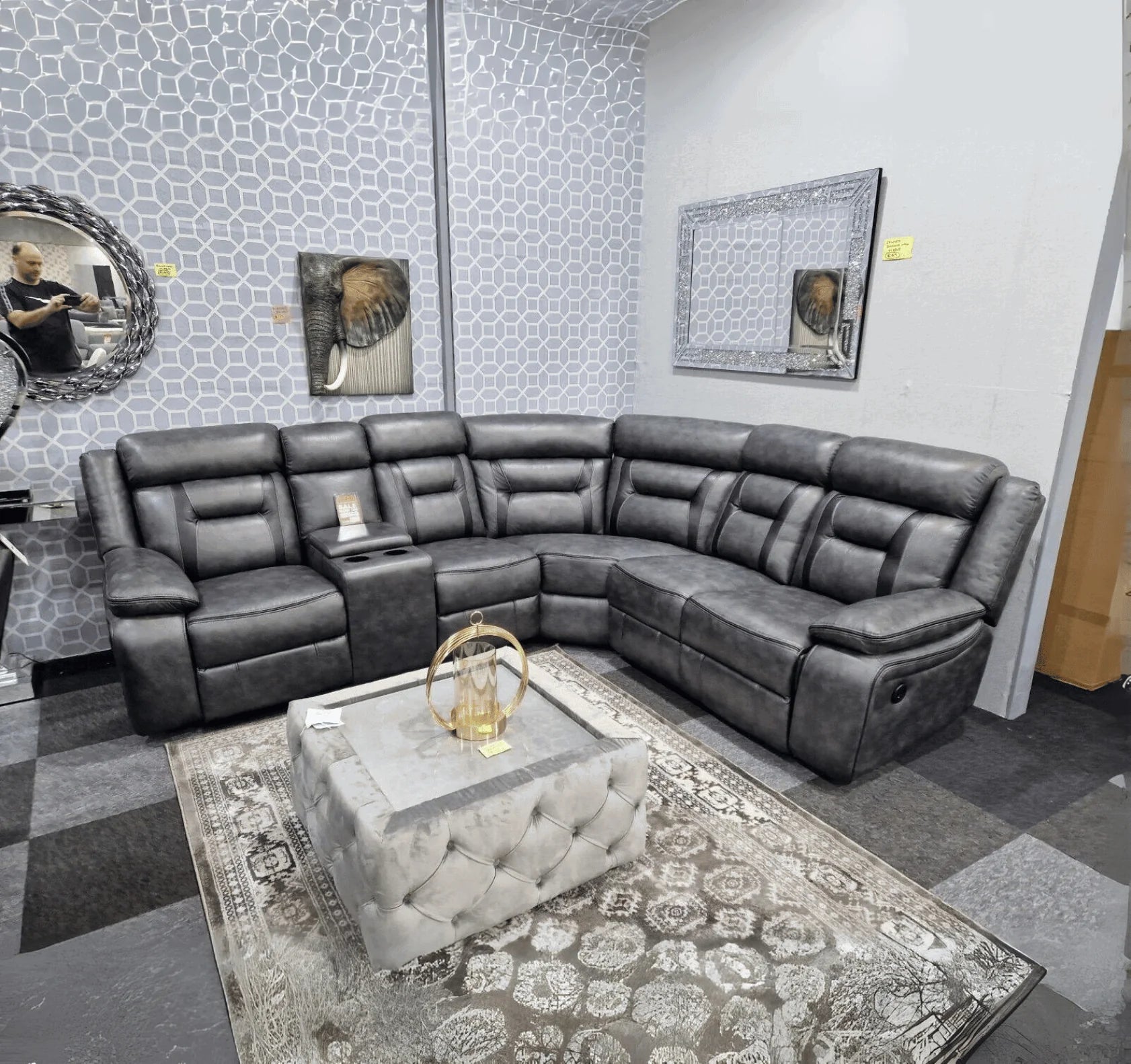 Nova grey electric leather corner recliner sofa with USB charging ports and cup holder console.