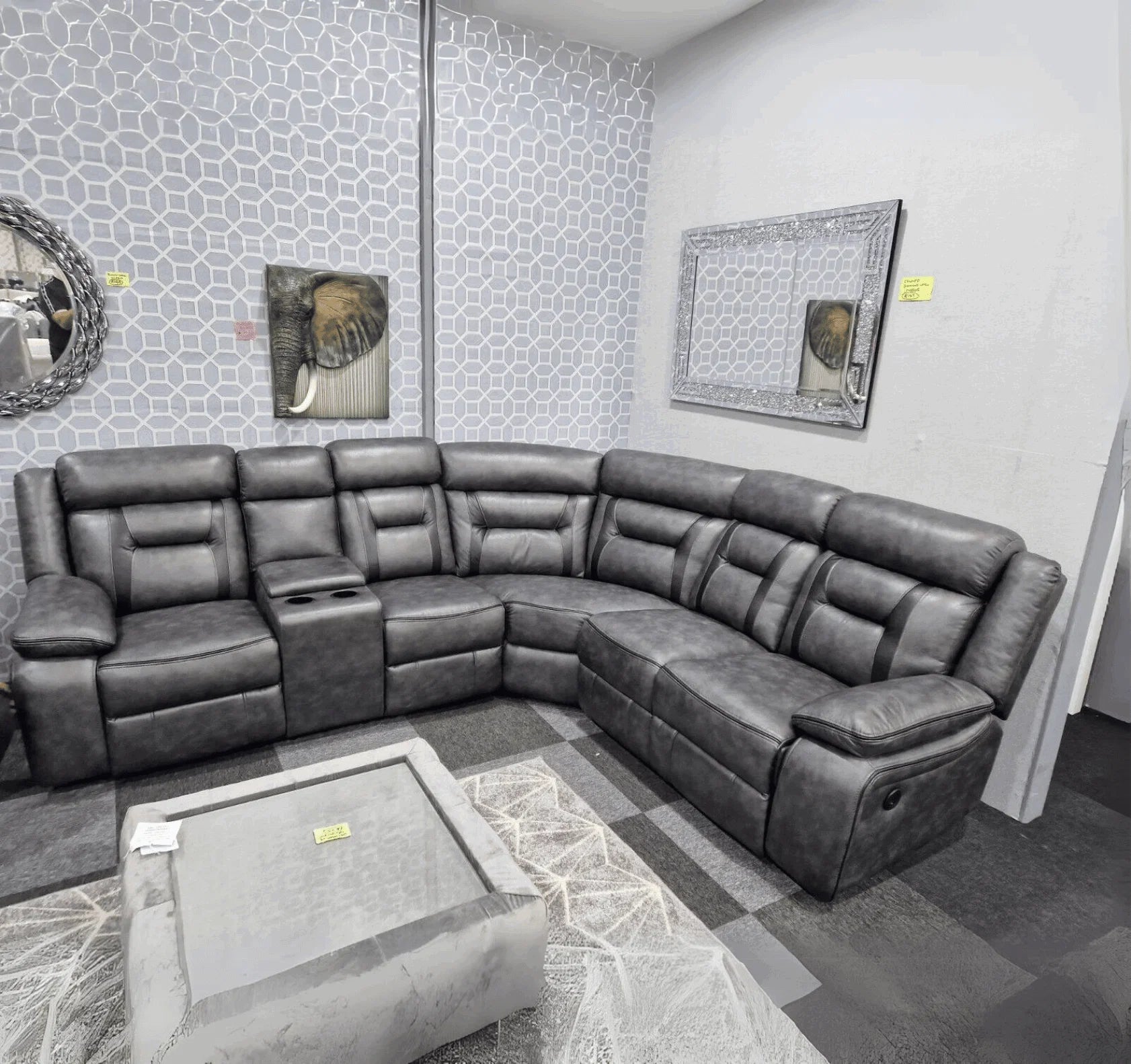 Premium grey leather power recliner sofa with spacious family seating.