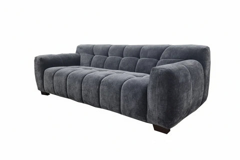 Designer velvet sofa collection with plush seating and deep channel tufting.