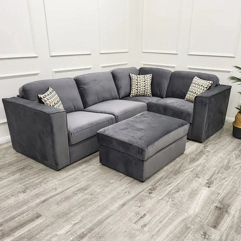 4 piece Luxury Hudson fabric corner sofa with fixed back cushions, modular L-shaped design, deep comfortable seating, and contemporary styling in a modern UK living room.