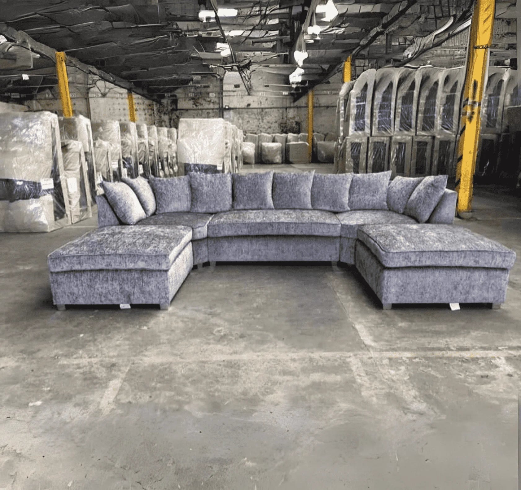 Luxury large U shape corner sofa with deep foam seating, movable footstools, removable washable covers, and contemporary styling for spacious UK living rooms.