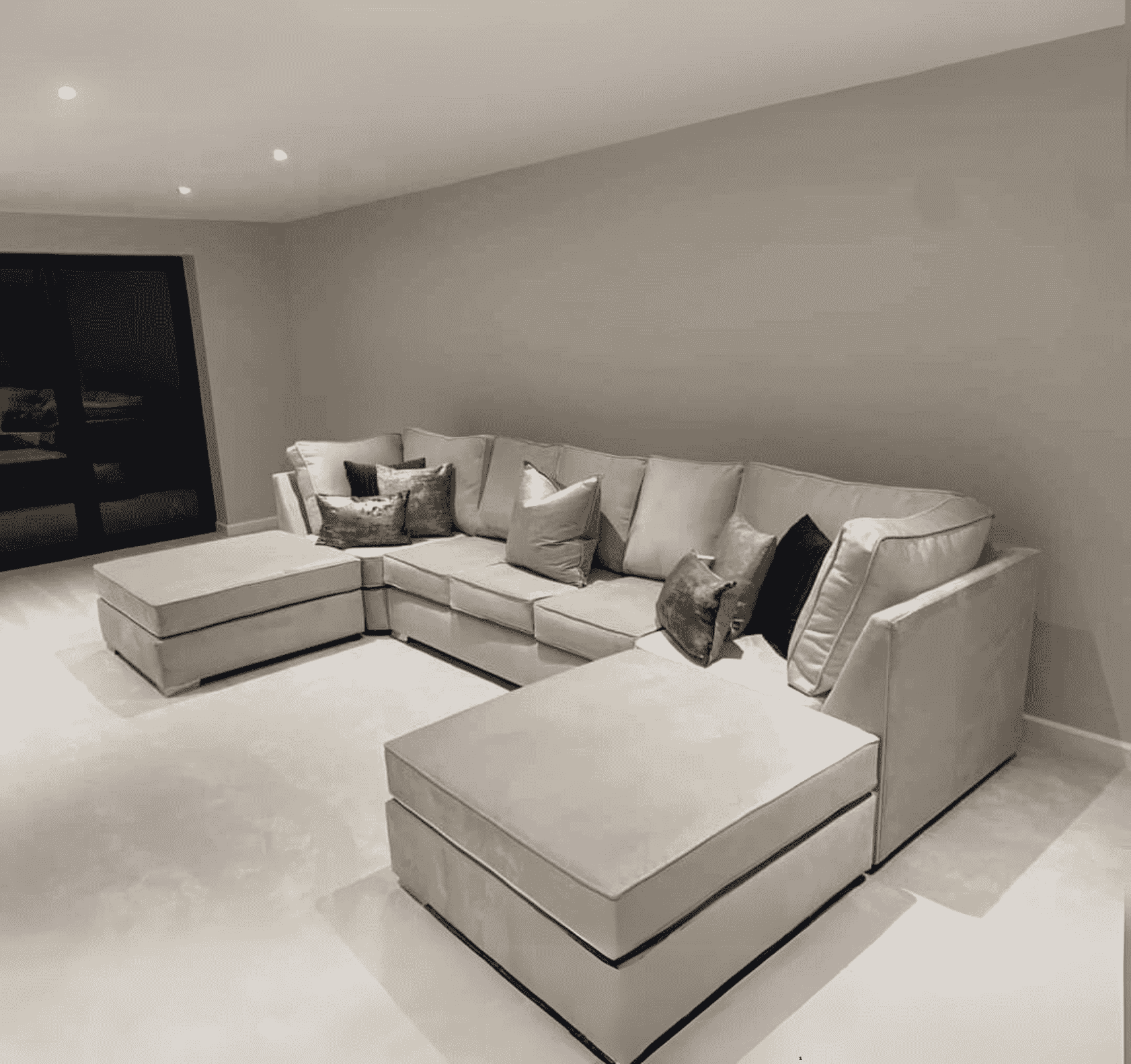 Luxury large U shape corner sofa with deep foam seating, movable footstools, removable washable covers, and contemporary styling for spacious UK living rooms.