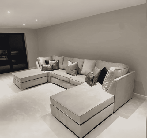 Luxury large U shape corner sofa with deep foam seating, movable footstools, removable washable covers, and contemporary styling for spacious UK living rooms.