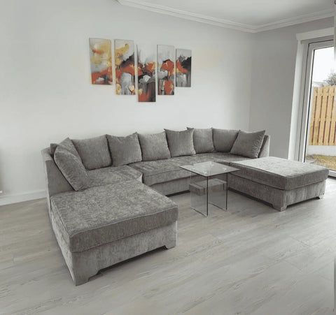 Luxury large U shape corner sofa with deep foam seating, movable footstools, removable washable covers, and contemporary styling for spacious UK living rooms.