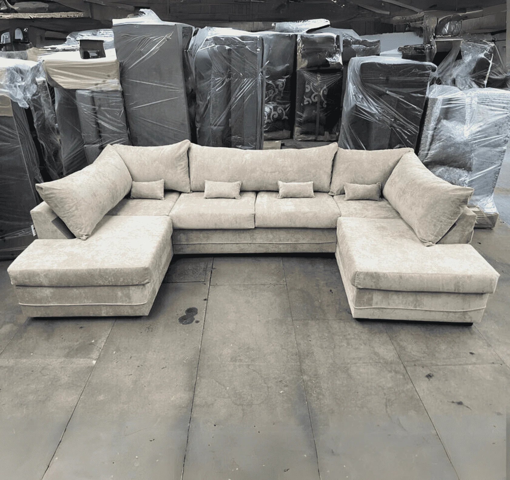 Luxury large U shape corner sofa with deep foam seating, movable footstools, removable washable covers, and contemporary styling for spacious UK living rooms.