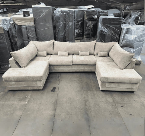 Luxury large U shape corner sofa with deep foam seating, movable footstools, removable washable covers, and contemporary styling for spacious UK living rooms.