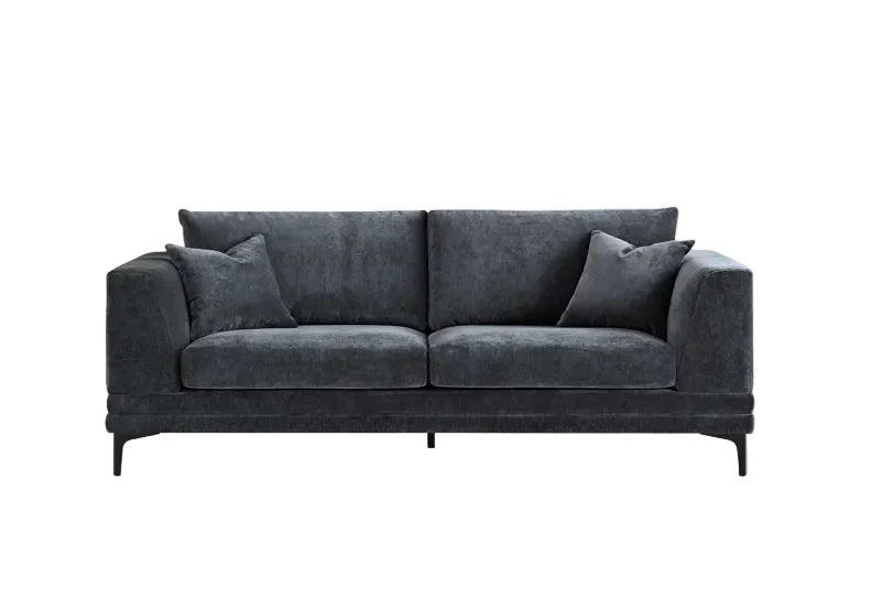 Luxury steel grey velvet sofa with a mid-century modern design, wooden plinth base, deep cushions, and elegant clean lines for contemporary UK living rooms.