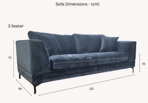 Luxury steel grey velvet sofa with a mid-century modern design, wooden plinth base, deep cushions, and elegant clean lines for contemporary UK living rooms.