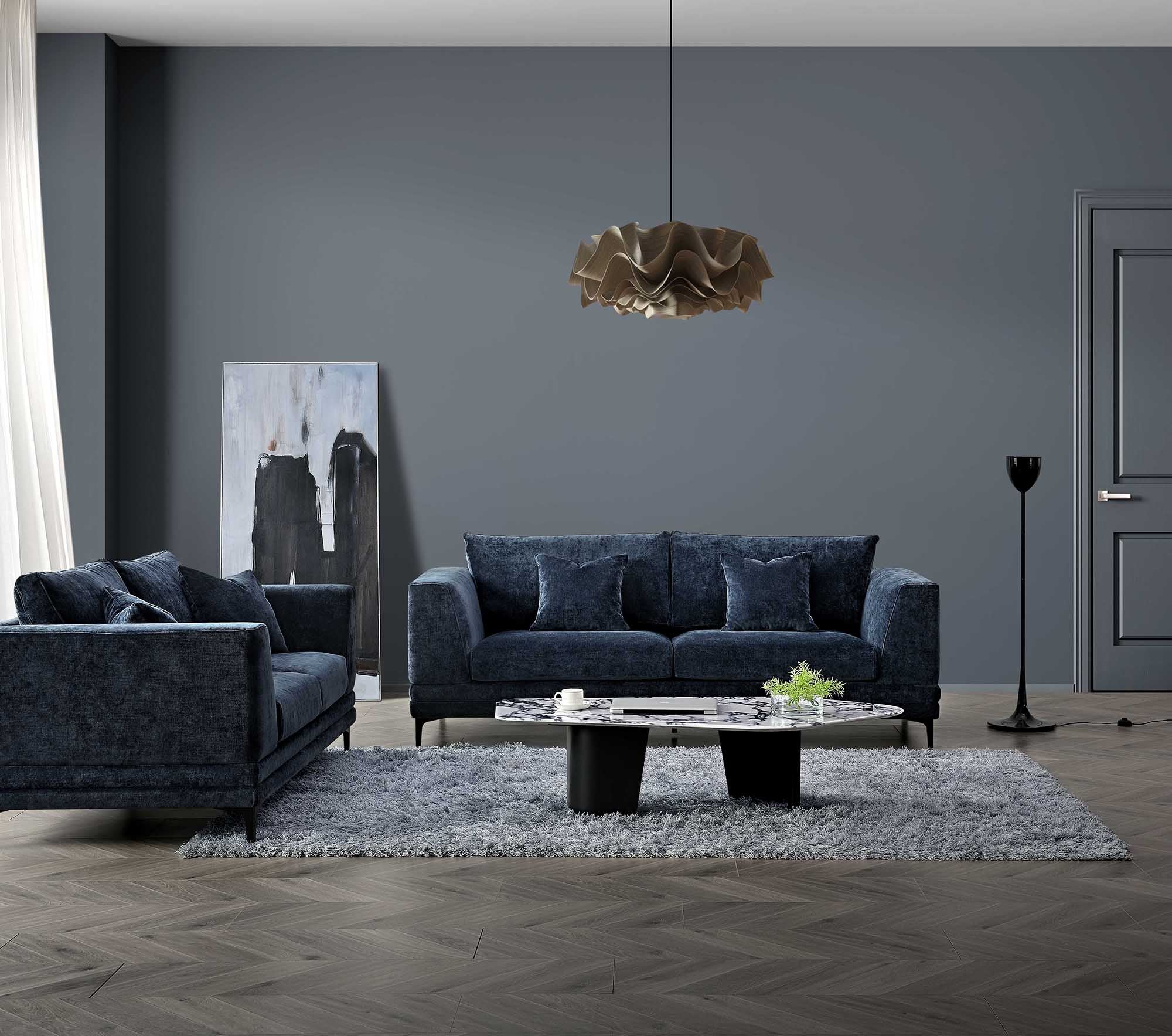 Luxury steel grey velvet sofa with a mid-century modern design, wooden plinth base, deep cushions, and elegant clean lines.