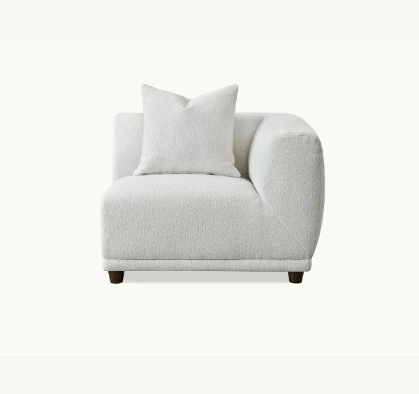 Luxury Lottie modular corner sofa upholstered in premium polar bouclé fabric featuring deep seating, soft curved lines, modular configuration for modern UK living rooms.