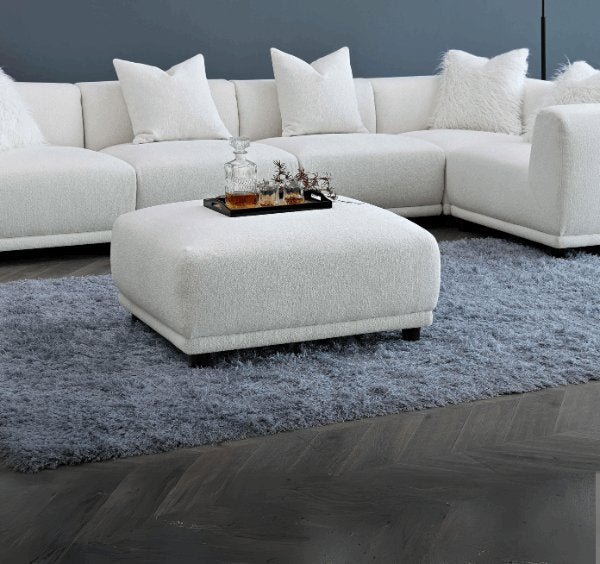 Lottie modular corner sofa upholstered in premium polar bouclé fabric featuring deep seating, soft curved lines, modular configuration, and contemporary styling for modern UK living rooms.