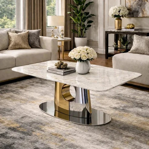 Madrid cream marble coffee table with silver and gold geometric pedestal base.