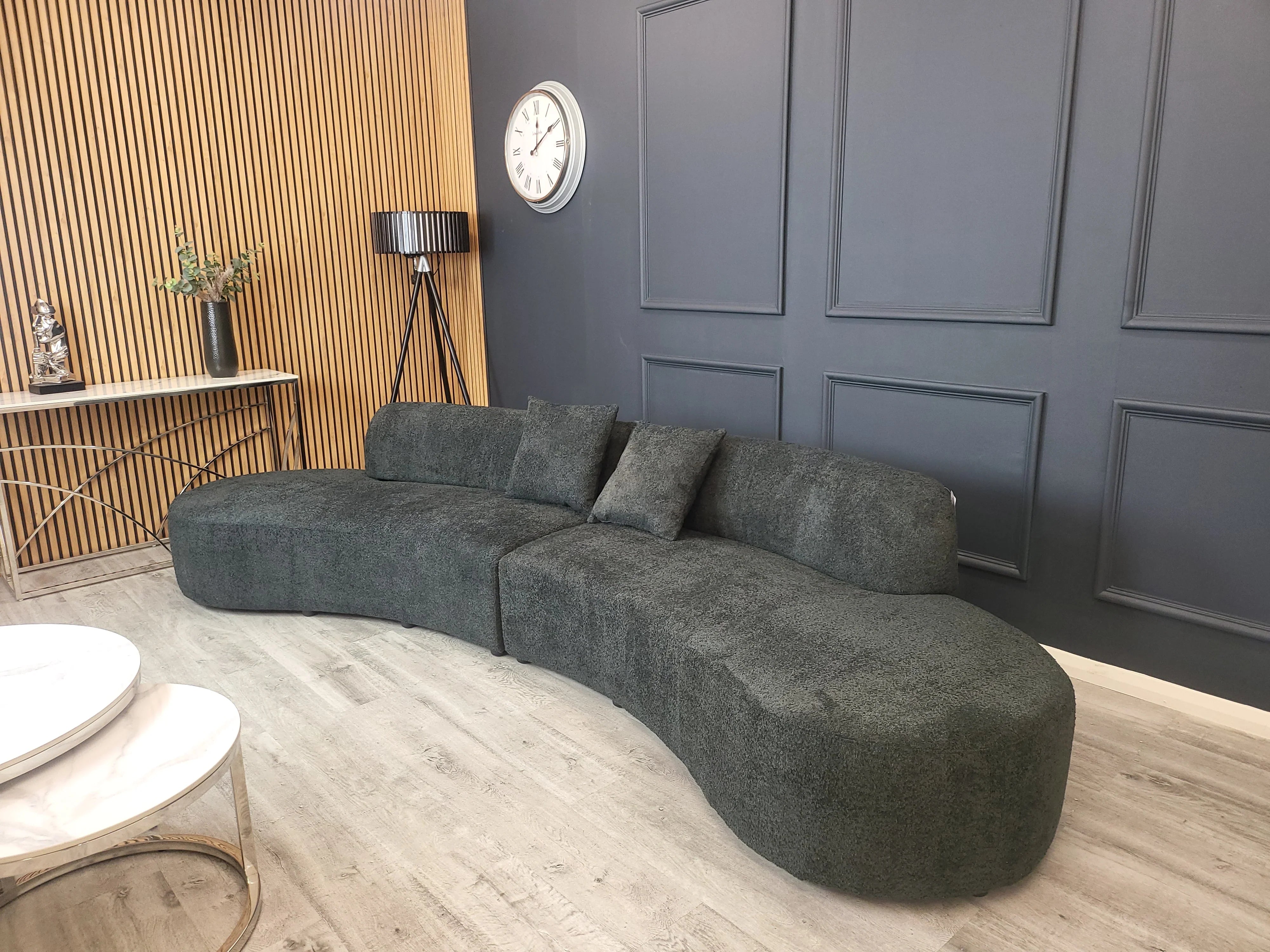 Miami curved 6-seater bouclé sofa with sculptural organic silhouette, deep cushioned seating, and premium textured upholstery in a contemporary UK living room.